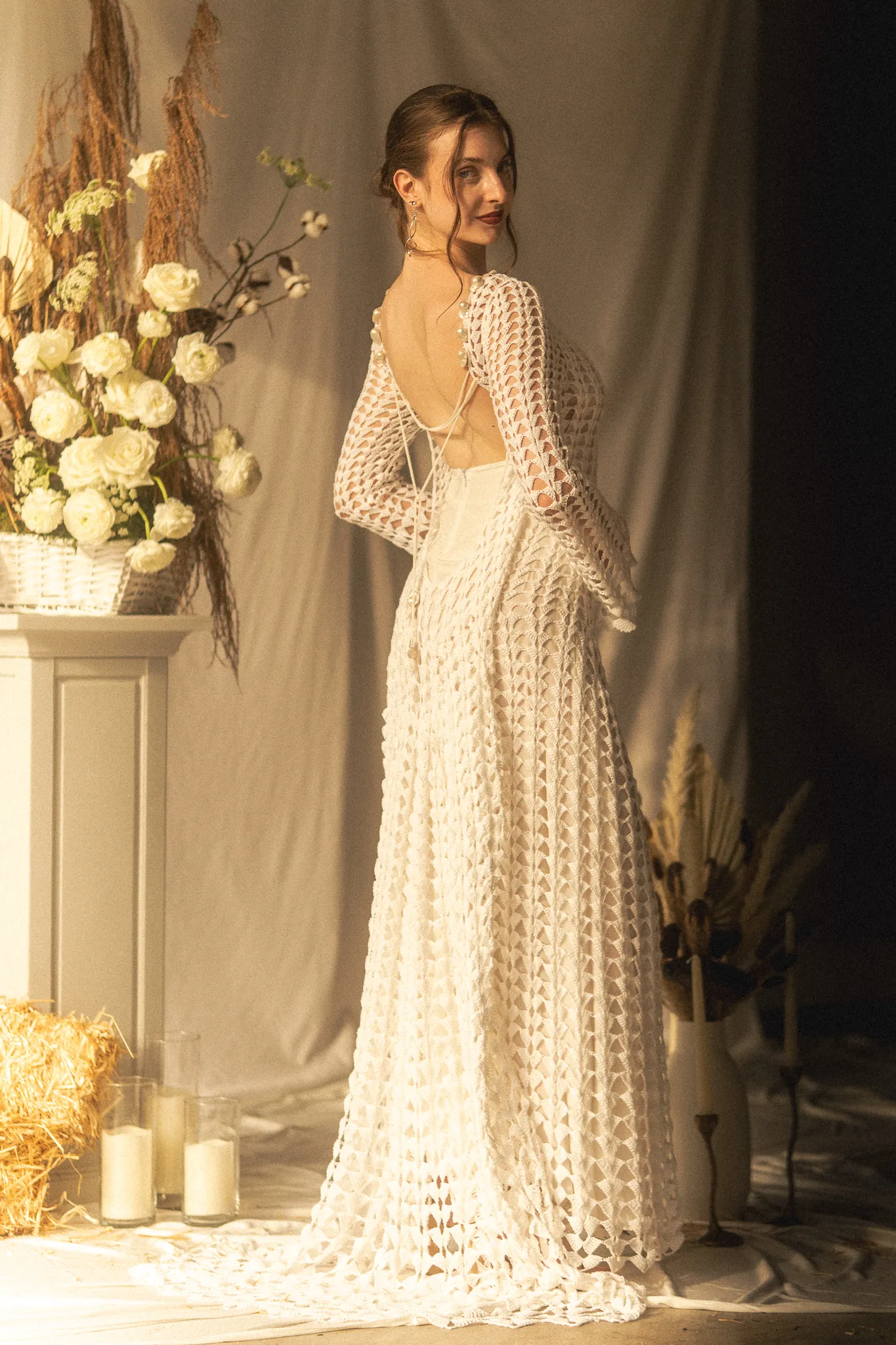 Bespoke hand-crocheted cotton wedding gown with silk lining and baroque pearl details, made to order in Texas by luxury house Looking Friday.